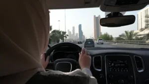 An image of a saudi woman sitting inside a brand new modern car